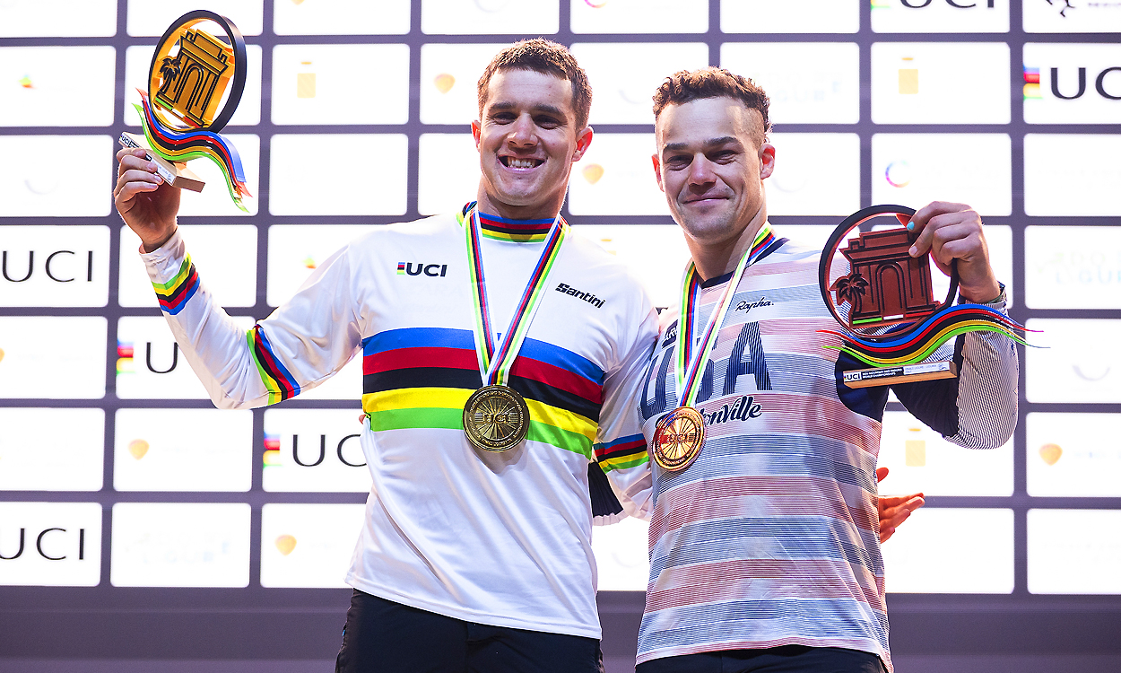 2 Young men pictured with gold and silver medals